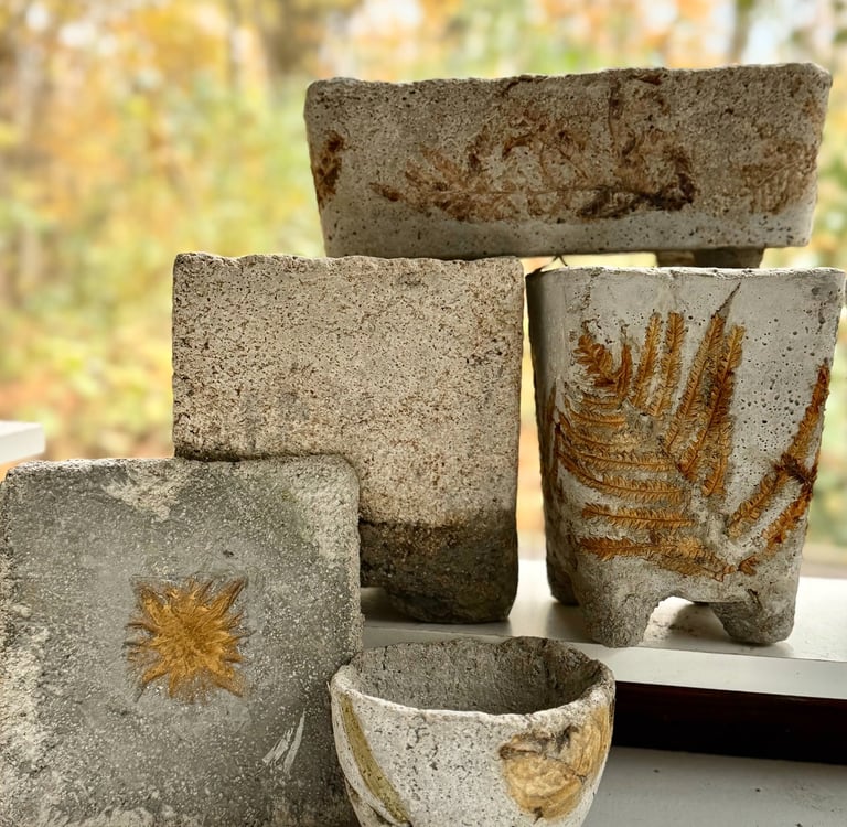 Selection of lightweight cement hypertufa garden pots and vessels.