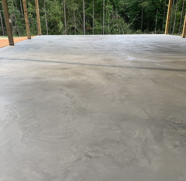 Concrete slab foundation installation for residential structure with reinforced concrete surface