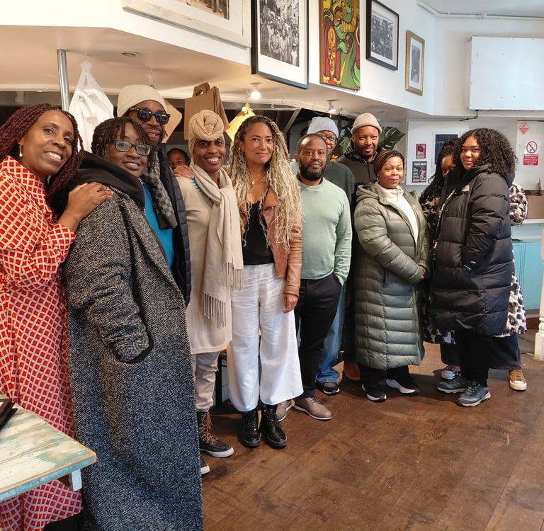 a group of people standing in the Portobello Shack