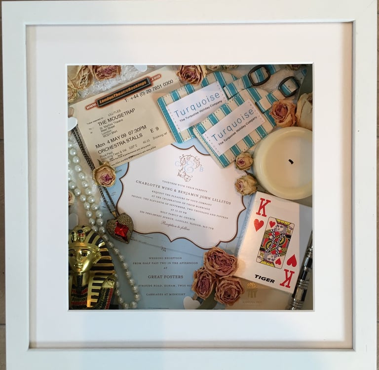 a Memory Box frame featuring wedding keepsakes and flowers