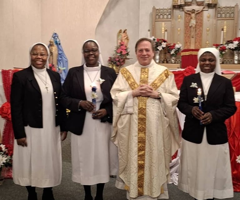 Catholic sisters posing with clergy during Sister's Day of Renewal of Vows