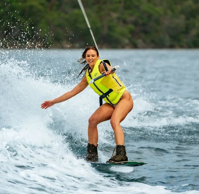 Wakeboarding at sunset during luxury catamaran tour in Papagayo Gulf