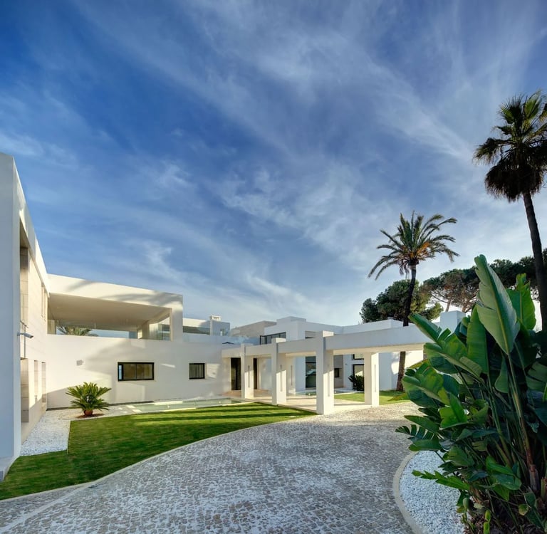 Interior courtyard with landscaped lawn and modern white architecture