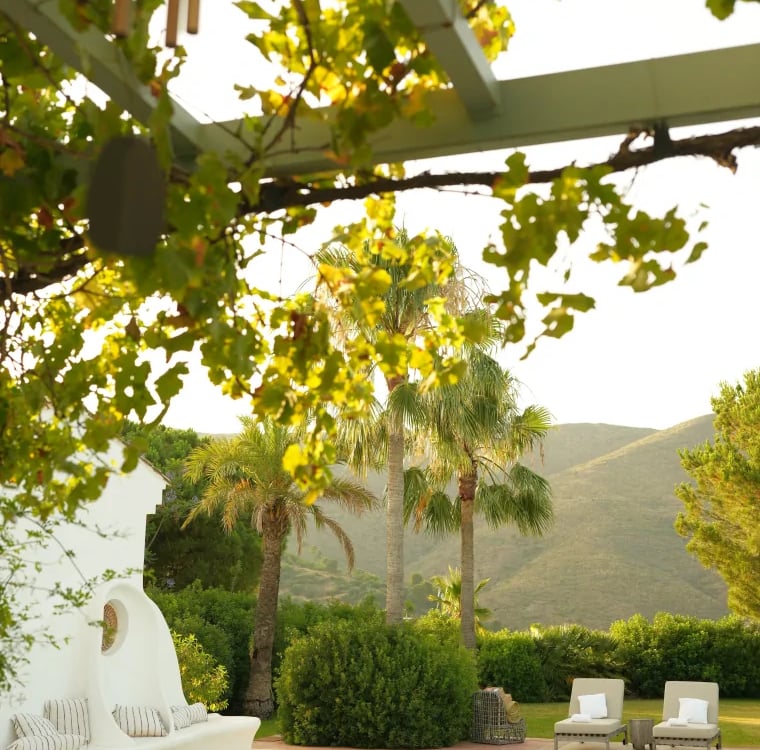 Private pool terrace with mountain views and shaded pergola