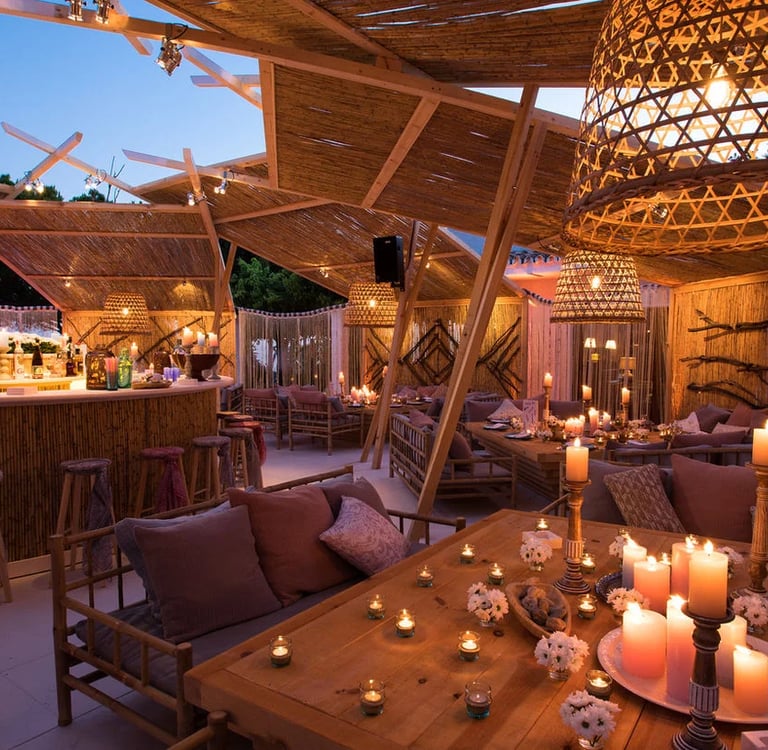 Outdoor lounge and bar setup for private villa event