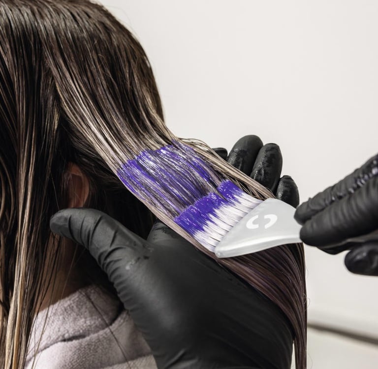 a woman is shown in a salon while her hair is dyed out