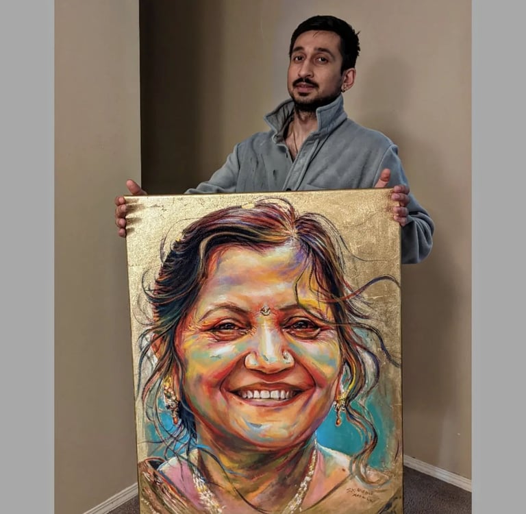 Artist S.K. Gusani holding a memorial painting of a smiling woman, gold leaf, portrait art