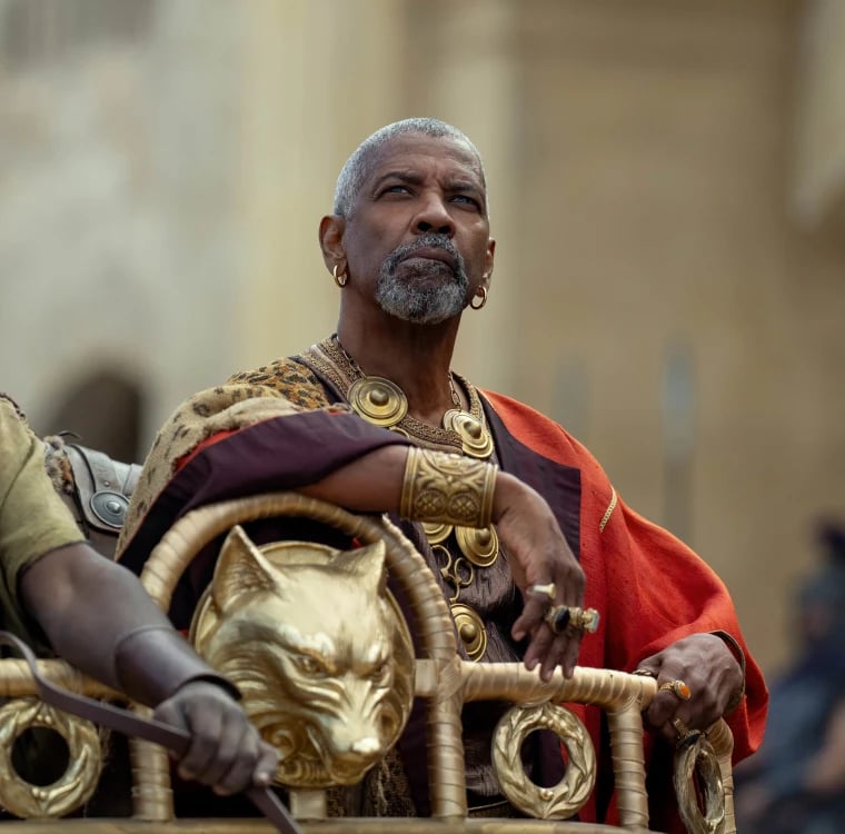 a man in a gold dress and a man in a gold dress