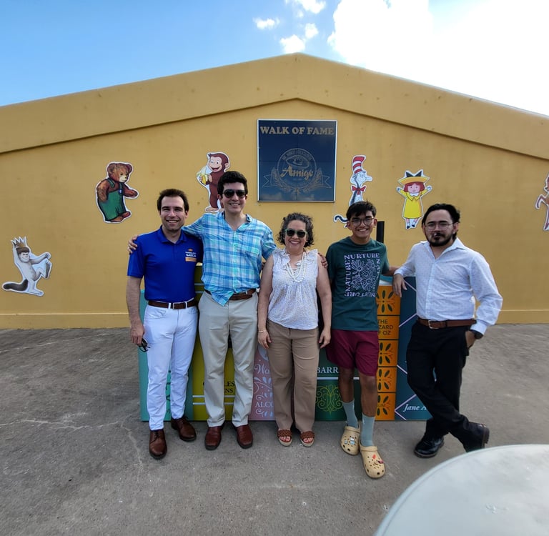 A group of people taking a picture side by side