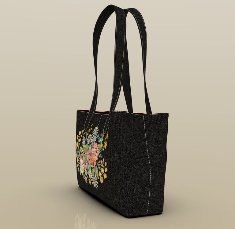 ide view of embroidered fashion bag by Cavity Studios showing premium material finish.