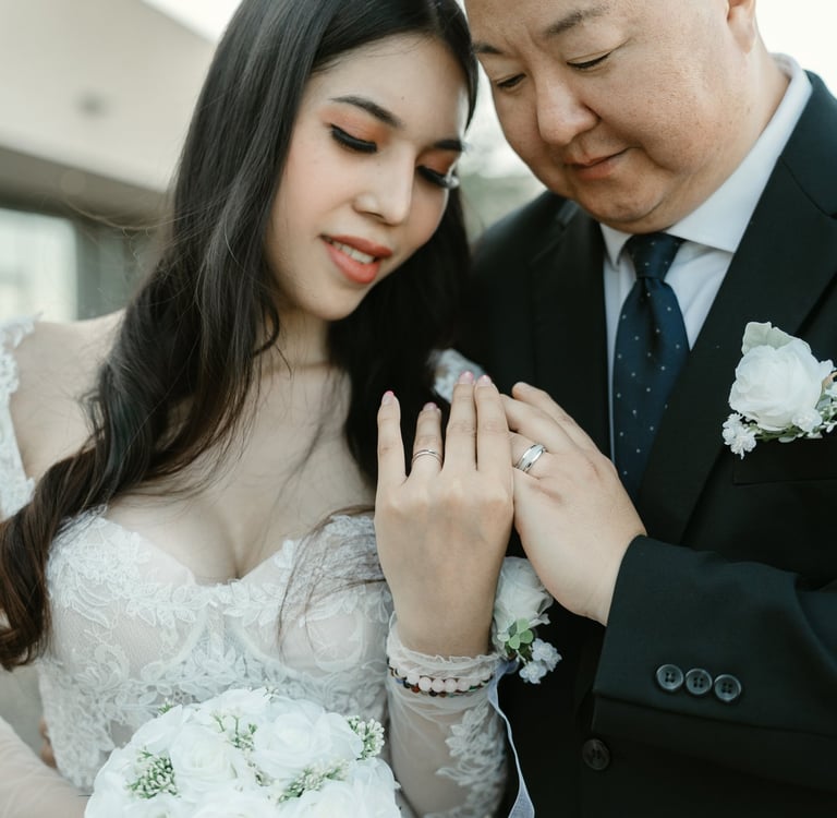 couple looking at thier rings