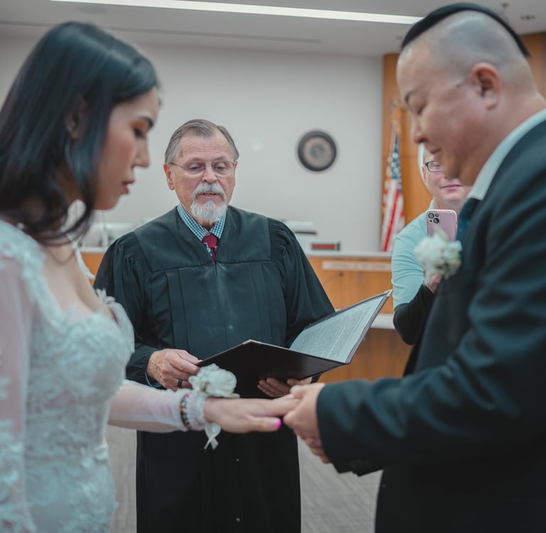 a man and woman getting married in a courtroom