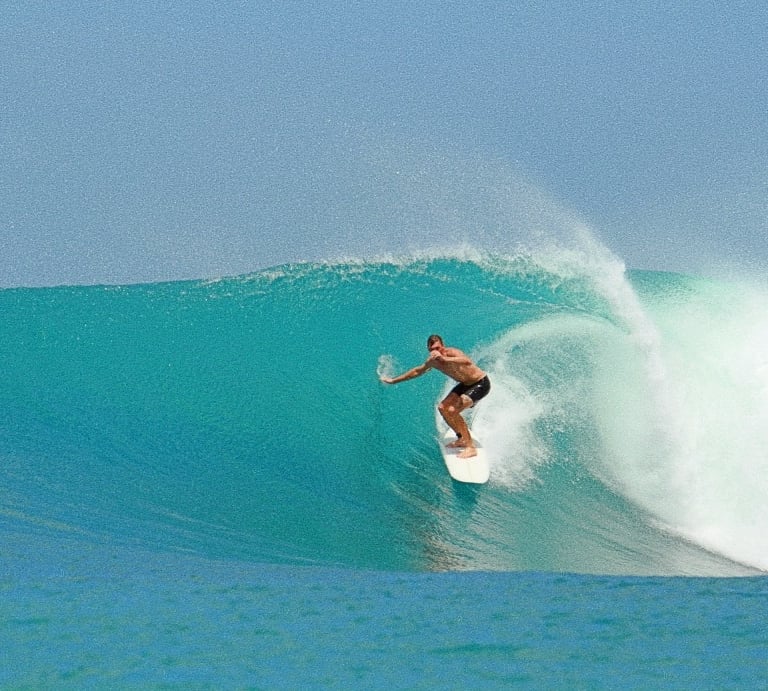 a man riding a wave in the ocean