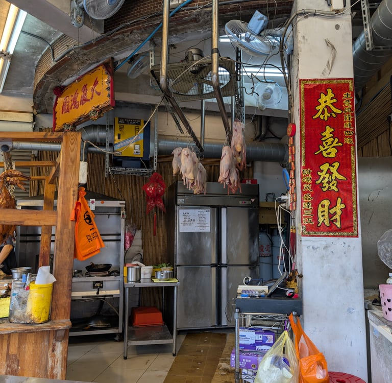 Roasted ducks hanging in a traditional Taiwanese restaurant kitchen in Yilan, Taiwan
