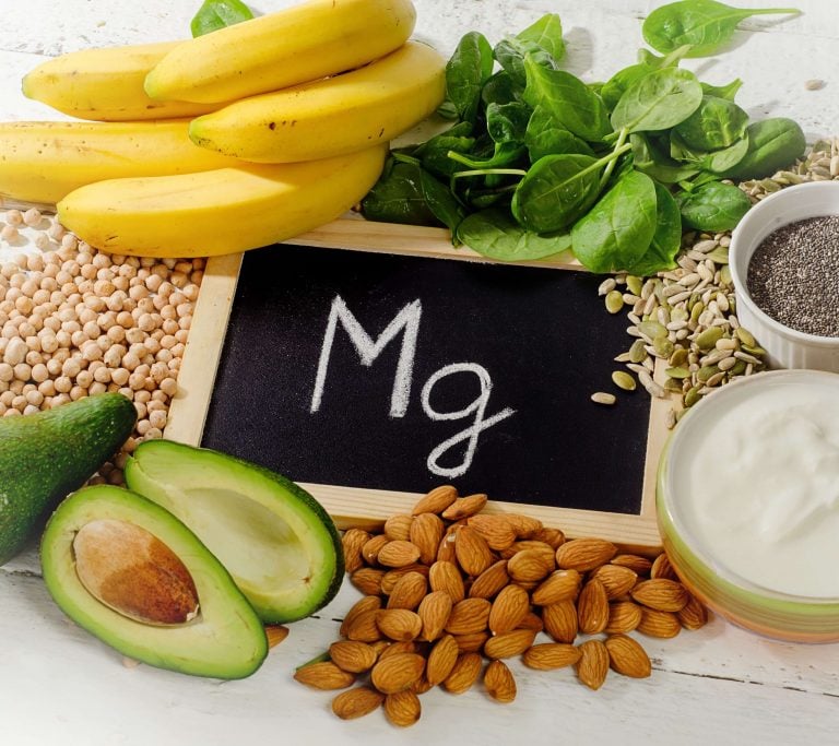 Magnesium-rich foods like leafy greens, nuts, and seeds, showcasing the health benefits of magnesium