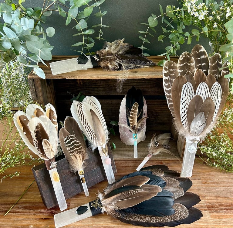 Selenite Healing Wands with feathers and crystals for energy clearing and spiritual alignment