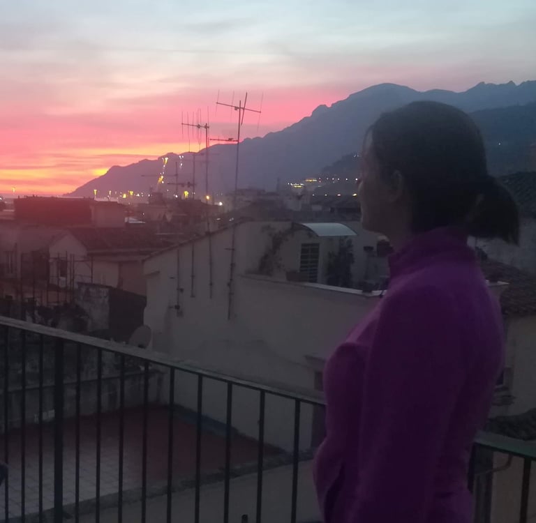 Giusy watching the sunset over the Amalfi Coast from the terrace in Salerno