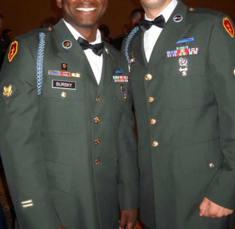 two men in military uniforms posing for a picture
