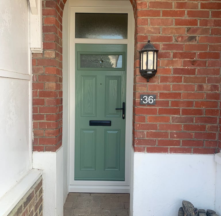 chartwell green door on red bricks and toplight with pulsar glass and antique black hardware