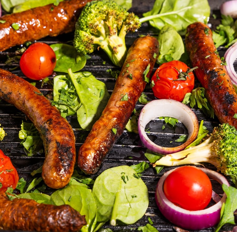 Sustainable plant-based, nutritionally-dense, hypoallergenic protein and fibre sausages with vegetables surrounding