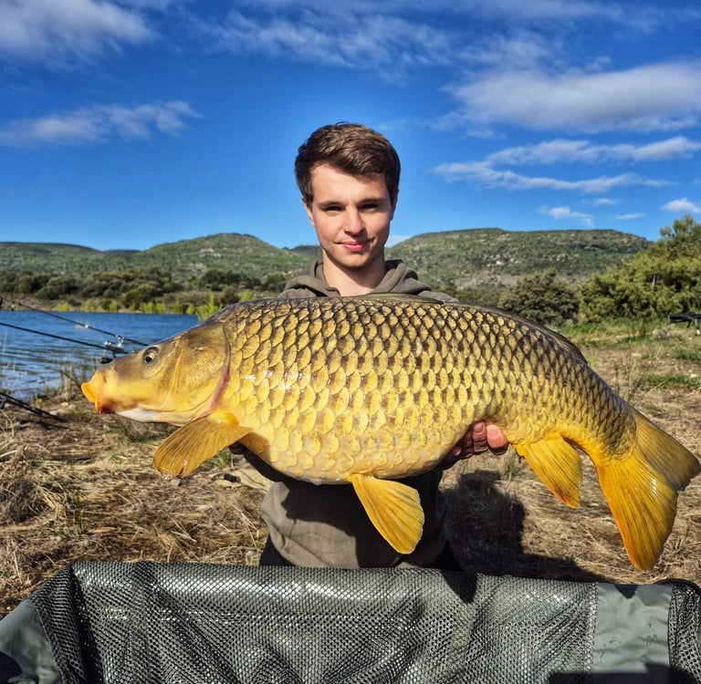 a man holding a fish carpel fish