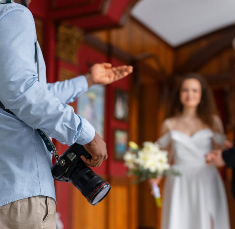 a man in a suit and tie is holding a camera