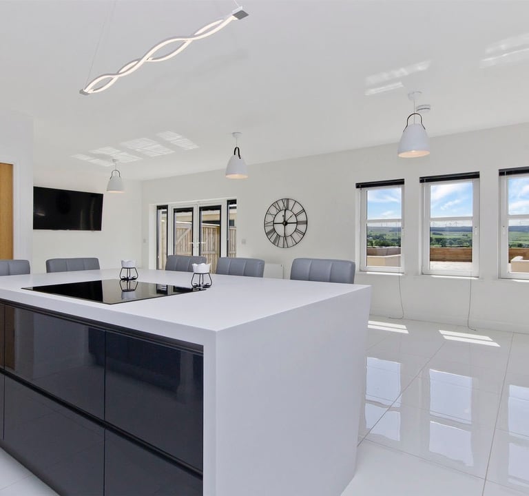 Luxurious bespoke kitchen in East Kilbride featuring Hi-Max countertops and integrated appliances