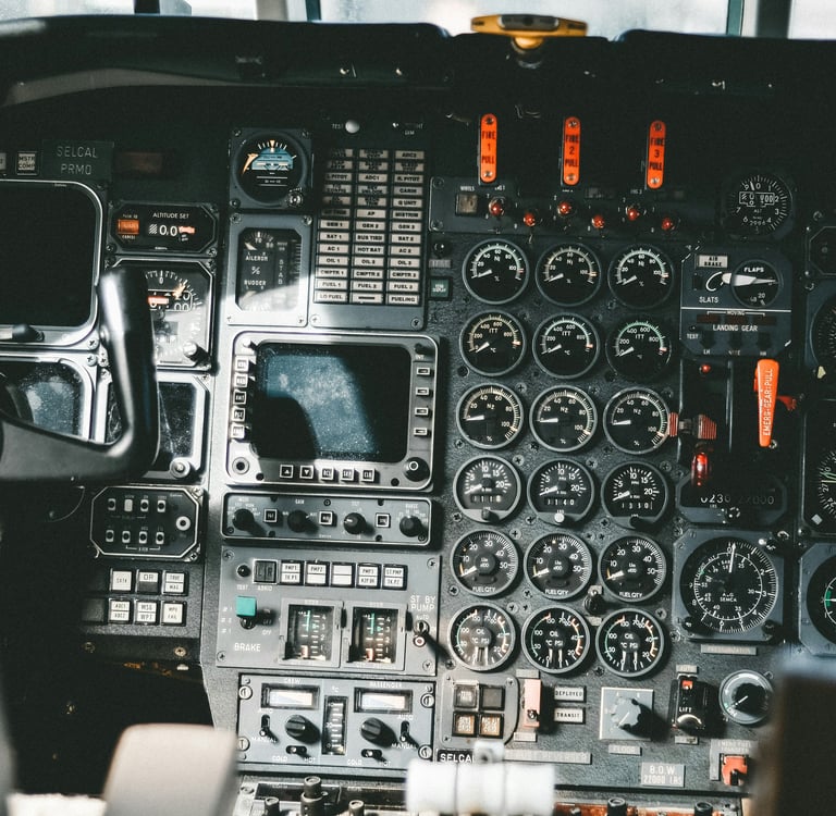 Glass cockpit of a medium aircraft displaying several avionics instruments