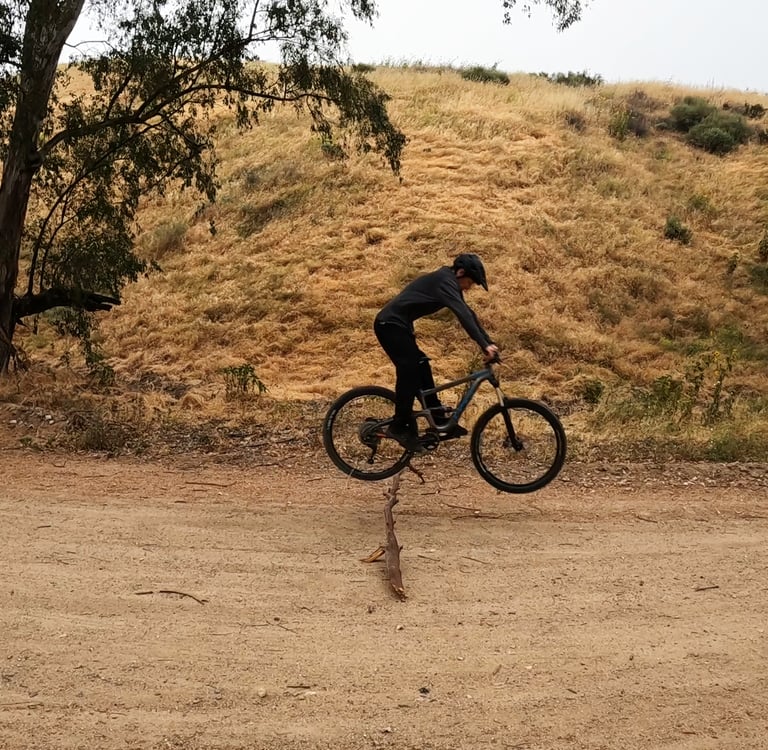 mountain biker leveling out bike after doing a bunnyhop
