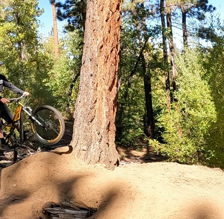 Mountain biker popping too early off the take off