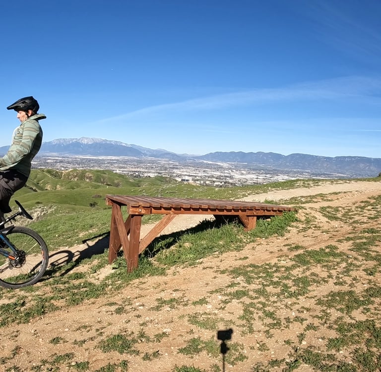 mountain biker going off drop