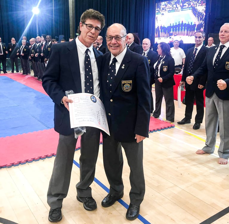 Shihan Michael Monaco receives 8th Dan from Hanshi Steve Arneil at 2019 BKK Open