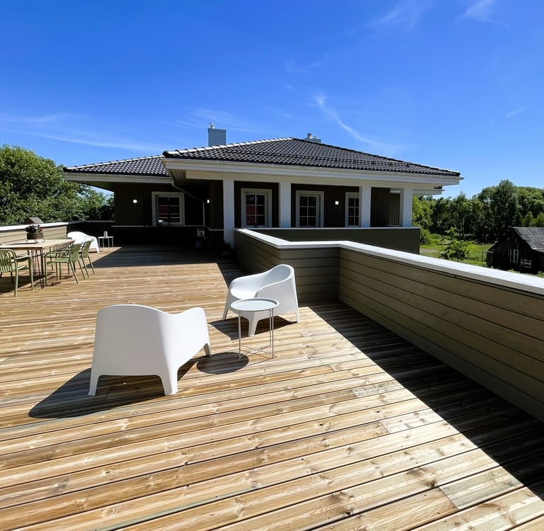 big sunny balcony terrace with furniture for dining and relaxing