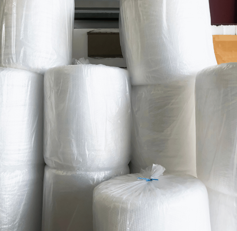 a bunch of rolls of plastic wrappers bubble wrap rolls