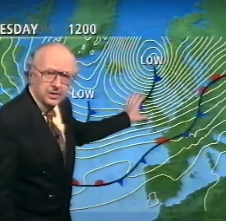 a man in a suit and tie is showinig a weather map