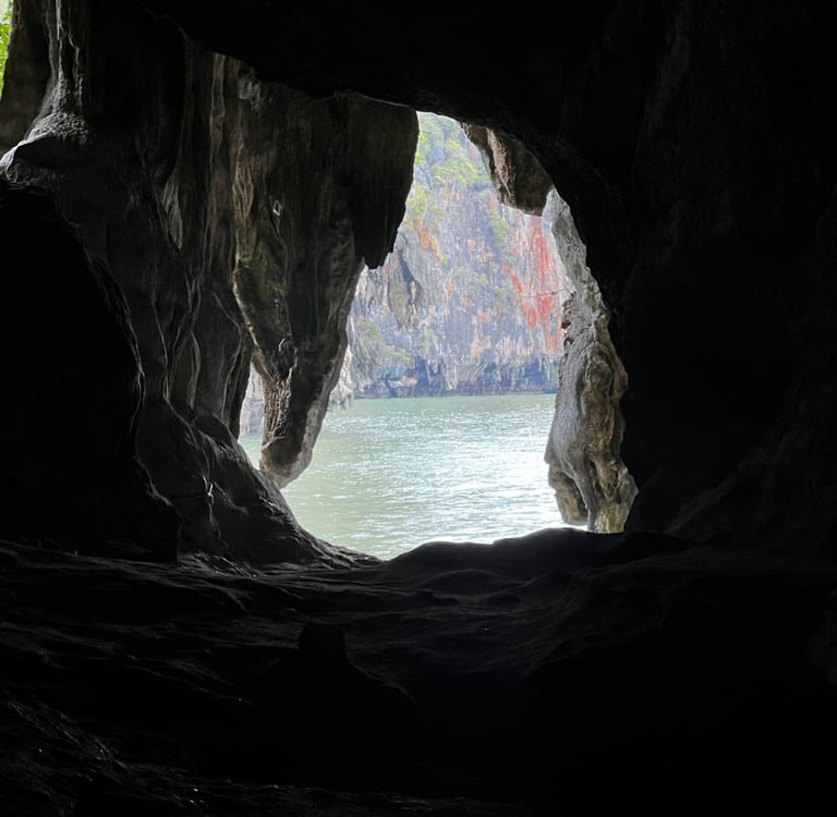 a hole at the end of a cave looks out at the Andaman Sea