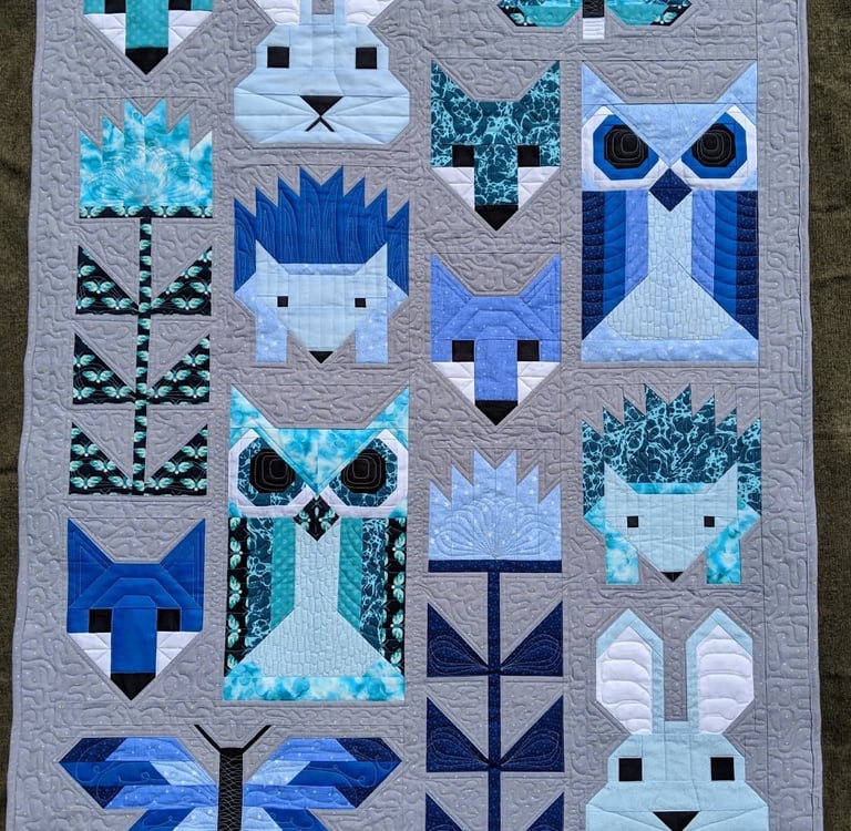 Elizabeth Hartman Fancy Forest quilt with colorful forest animals