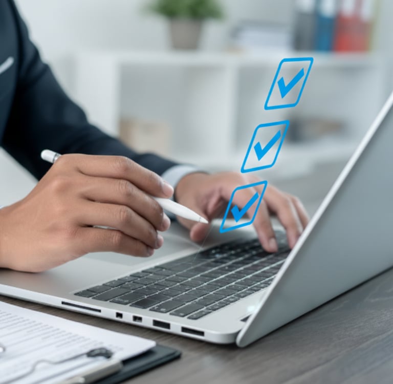 Close-up of professional using laptop with checklist overlay, symbolizing ERP business case success.