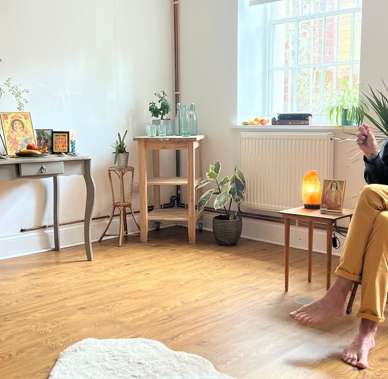 meditation teacher in yellow trousers and blue shirt