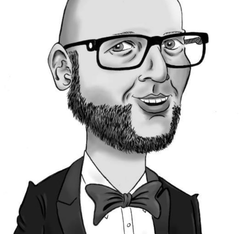 a man in a tuxedo suit and bow tie