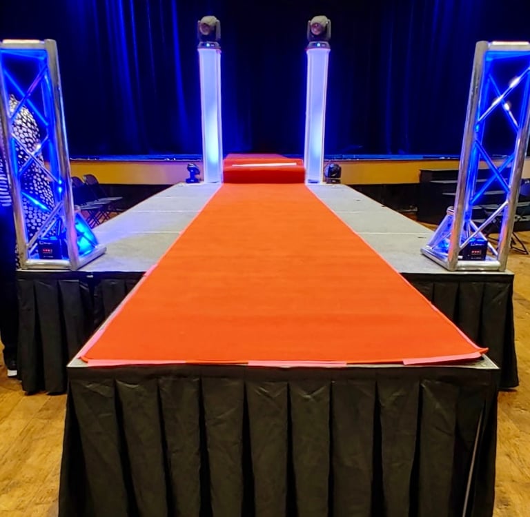 Red Carpet on a runway style stage, available for rent from MadDawgs Entertainment