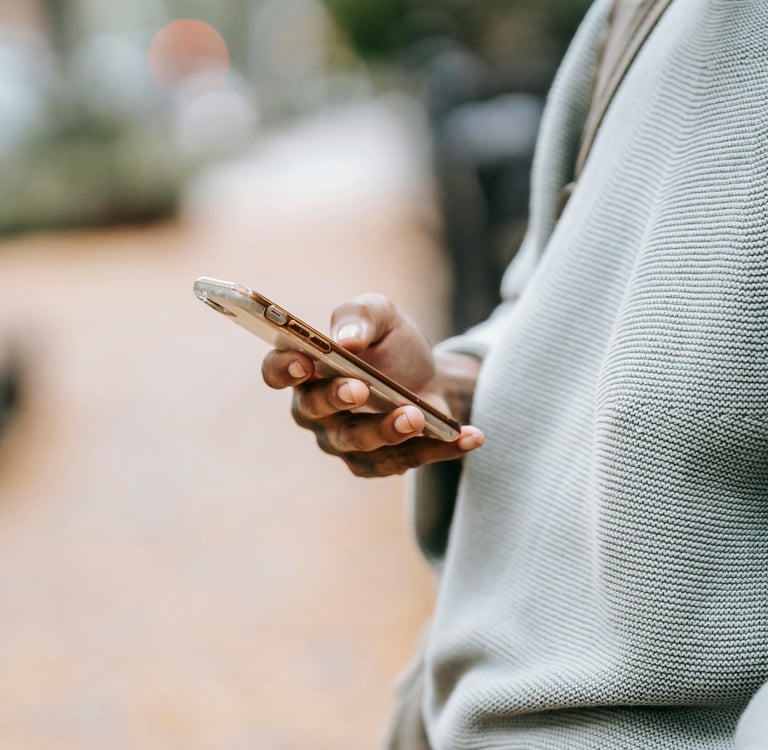 Hand holding a phone during an online video consultation with a veterinarian – ideal for pet owners