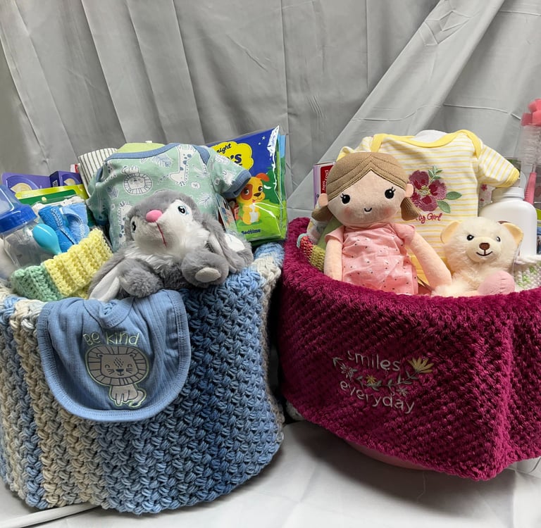 A pair of New Baby Welcome Baskets. Welcome Baskets contain everything baby needs for the first week