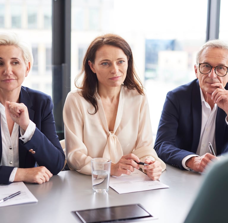 a group of people sitting around a table