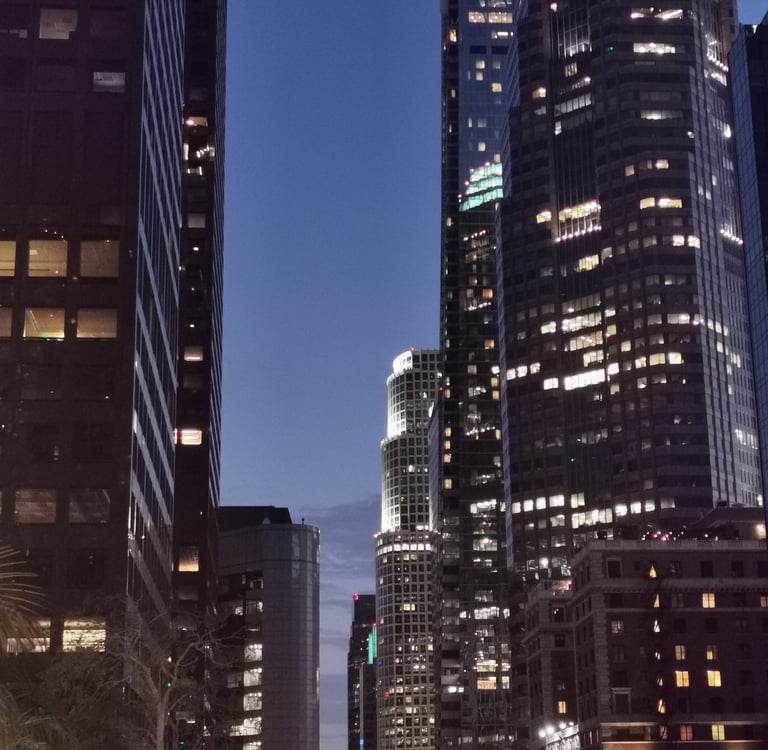 a city street scene with a traffic light at night