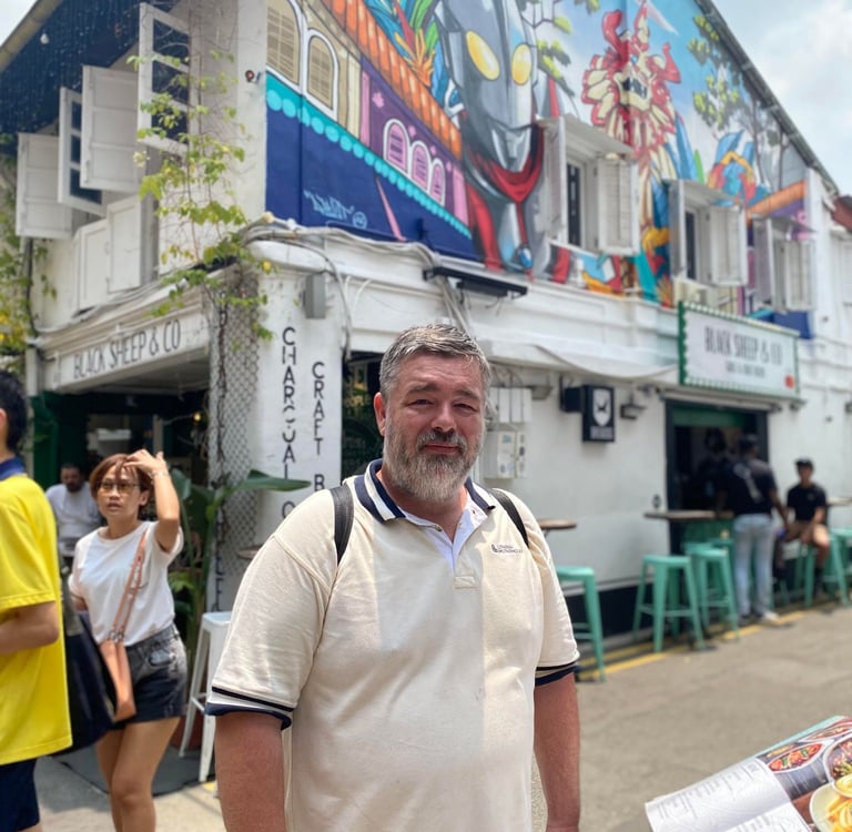 Image of Author: Jason A Ellis traveling the world, local area in Singapore