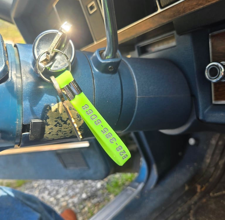 Keys with a green key tag in a classic car ignition