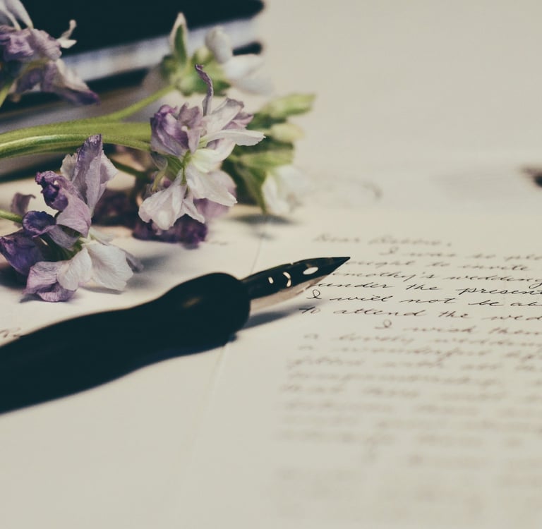 Image of purple flowers on paper. Photo credit: Unsplash and Debby Hudson