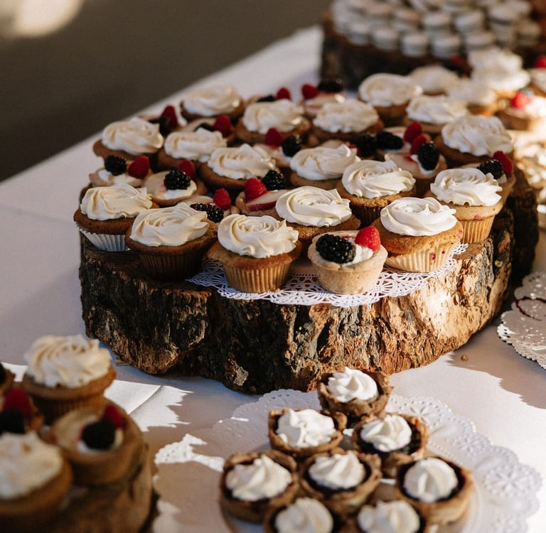 Selection of cupcakes shown as part of a rustic dessert bar in Bozeman Montana