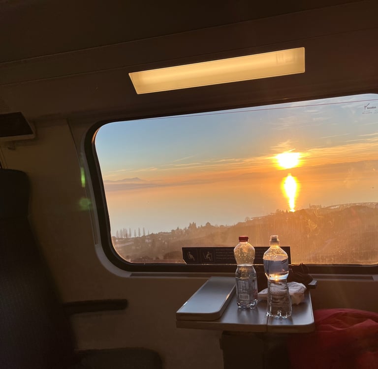 View of a sunset over Lake Geneva from the train outside of Geneva Switzerland